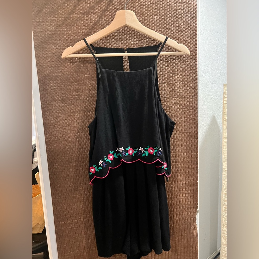 Black romper with shorts with flowers detail